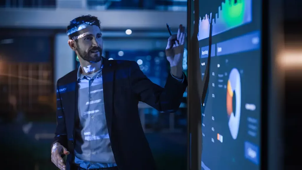 A man making a presentation with infograaphics